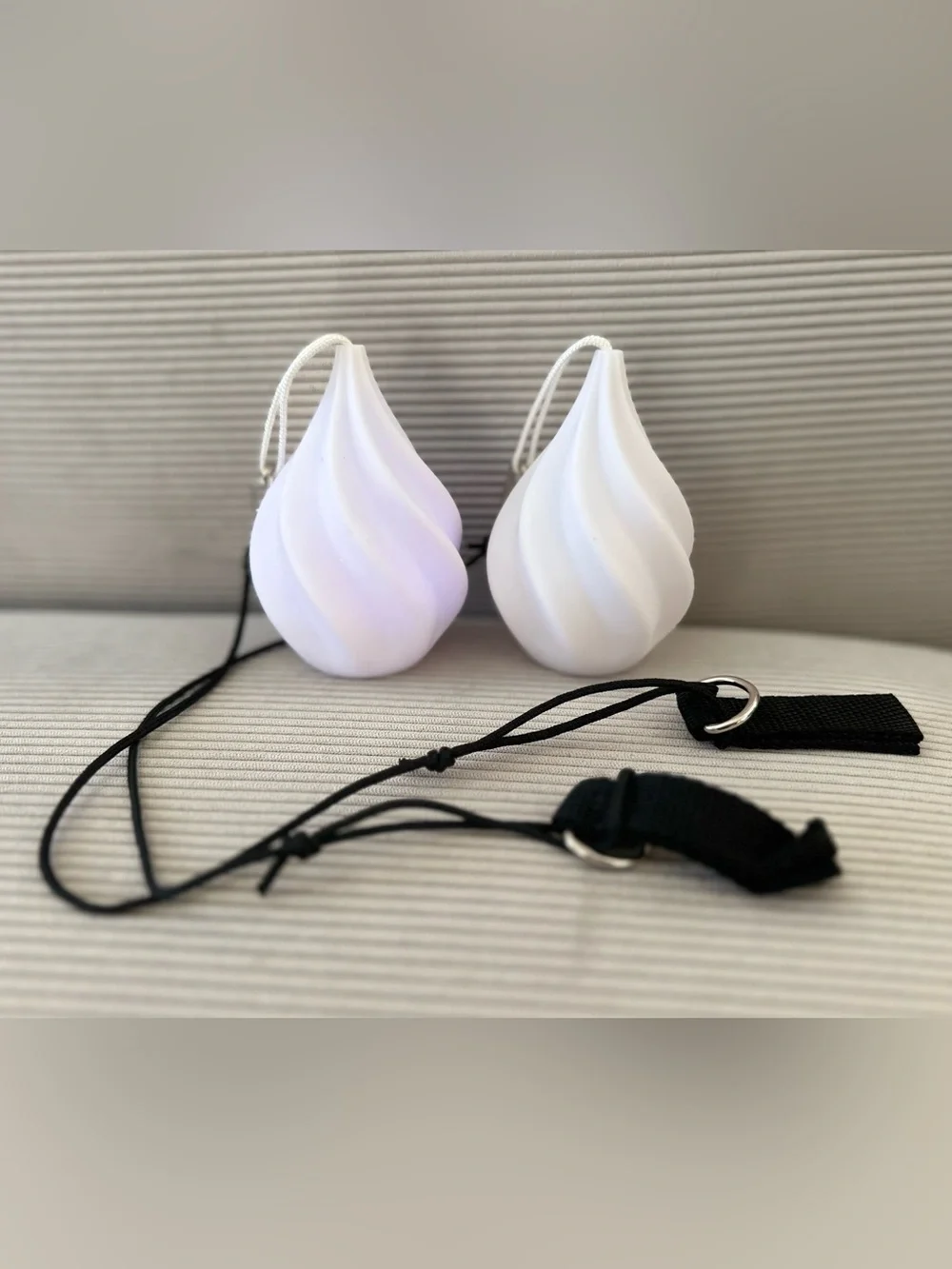Set of swirled teardrop LED Poi balls - glowing flow arts